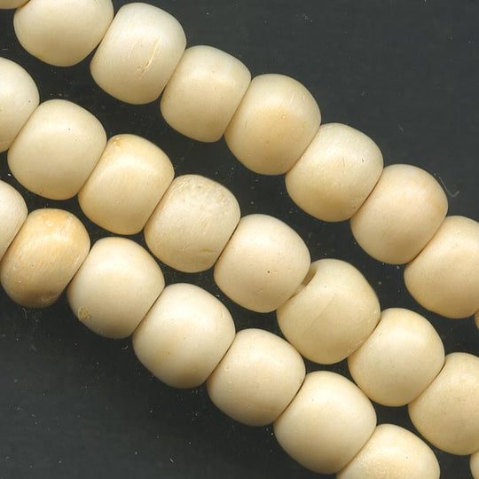 Vintage carved bone rounds. 6x7mm pkg of 25. b3-bo144