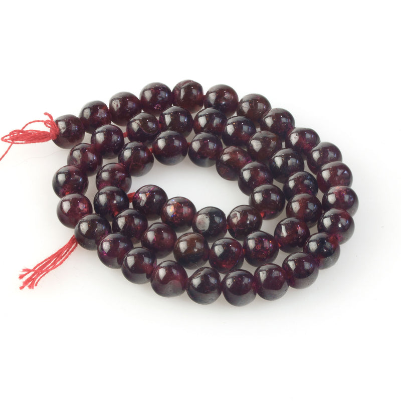 AA quality Rhodolite 6mm hand cut smooth round garnet beads. 1970s.  16".