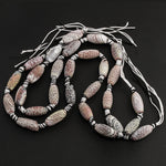Strand of crackle agate oval beads. 19x9mm.