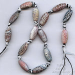 Strand of crackle agate oval beads. 19x9mm.