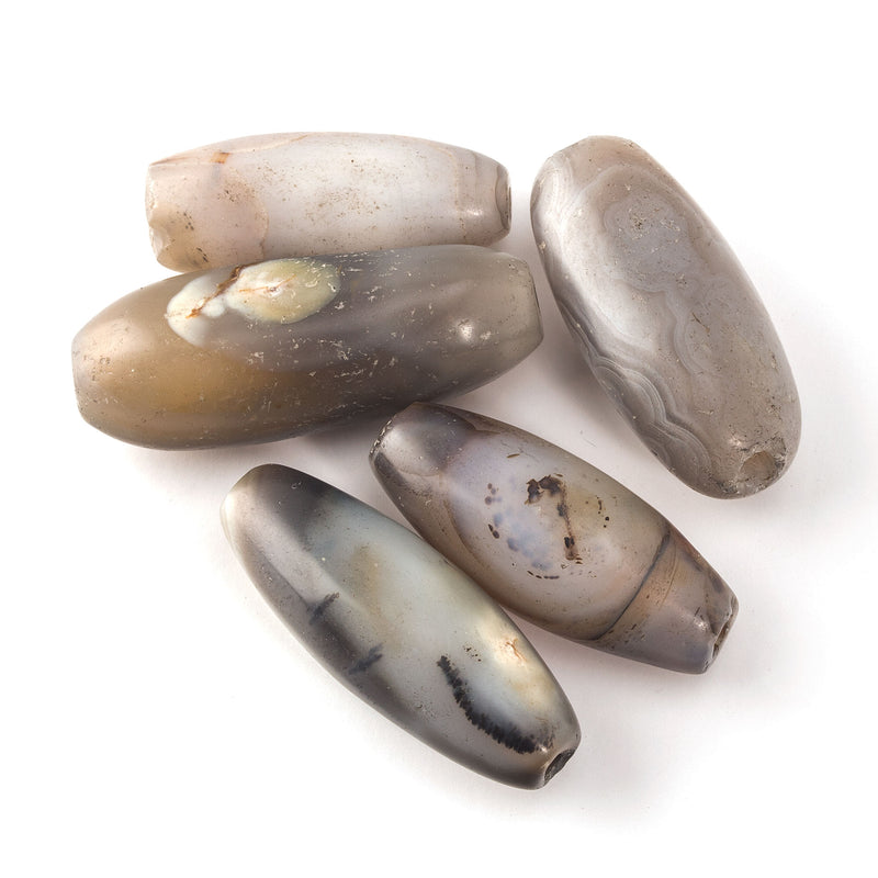 Antique agate beads in white, greys and brown from the African trade. 