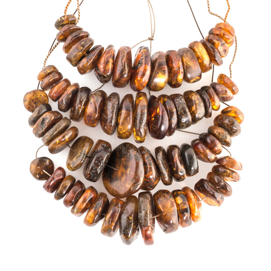 Natural Baltic amber carved disk beads, graduated strand of 16pc . b4-amb078cs