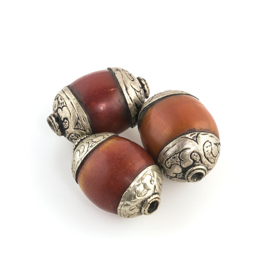 Vintage Tibetan Amber resin oval bead with coin silver bead caps