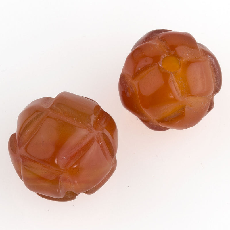 Deep carved translucent faceted carnelian knot beads . 12mm. 1pc.