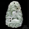 Vintage carved nephrite jade pendant depicting fruit tree and dog.