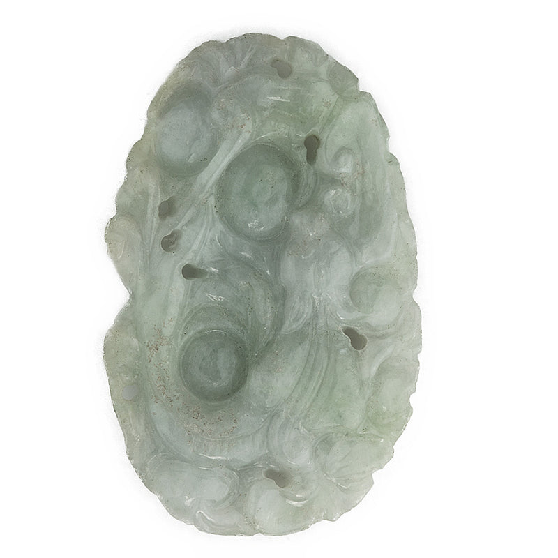 Vintage carved jadeite pendant depicting animal head in the leaves