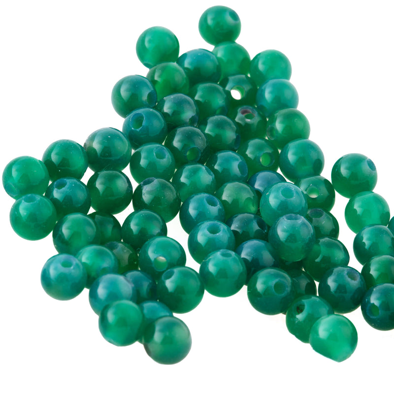 4mm smooth translucent green onyx beads.  Vintage stock 1990s. Pkg50.