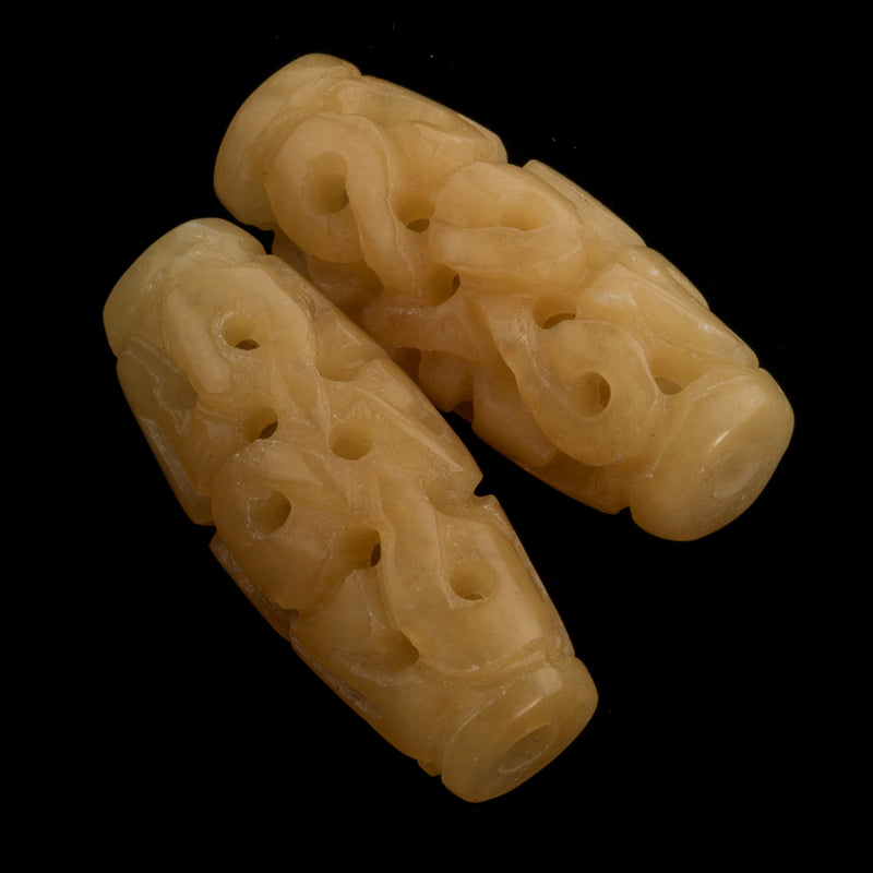 Deep carved and pierced yellow Hsiu Jade serpentine elongated oval. Sold individually. b4-ser470