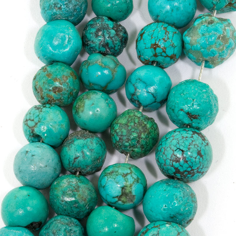 Chinese matrix turquoise rounds. Average 6mm. 4.5" strand. 