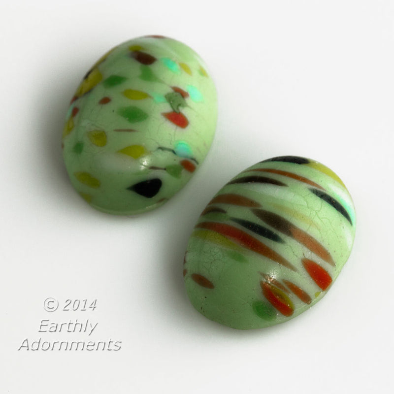 Vintage Japanese glass 18x13mm opaque mint green cabochon with multi-color striations. Sold individually.