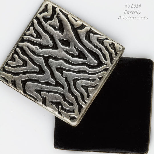 Plastic tile black, swirled metal top, cabochon. 32mm x 32mm. Pkg of 4.  b6-214