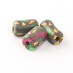 Fimo clay cylinder beads in the style of African trade beads.