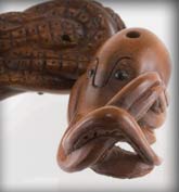 Hand carved boxwood octopus ojime bead. 14x24mm. Pkg. of 1.
