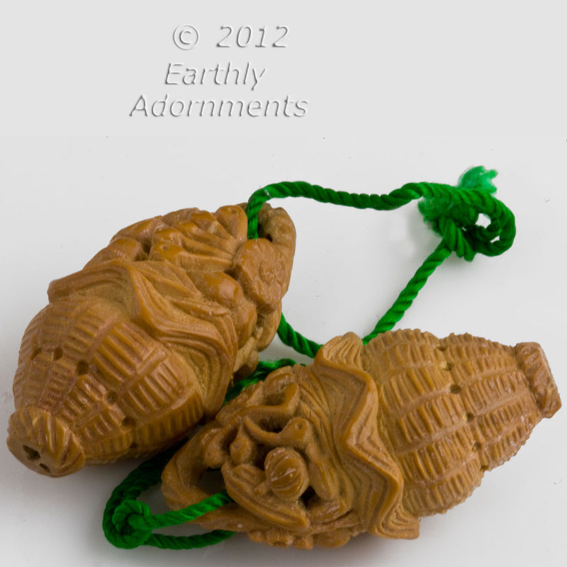 Vintage Chinese carved Hedaio fruit pit basket pendant . 