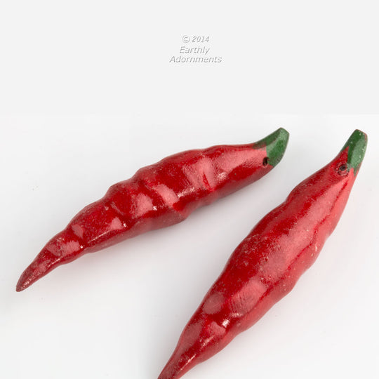 Vintage carved, painted and lacquered chili pepper pendants. Avg. size 55x10mm. Sold individually. b7-wo304