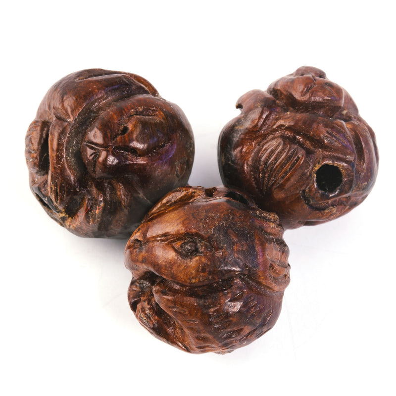 Ma-Li wood carved bead depicting a rabbit wrapped around the bead. 18mm. China. Sold individually.