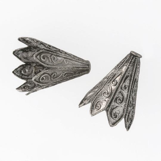 Finely decorated silver-plated cones. Sturdy and good quality. 20mm x14mm. Pkg. of 2. B9-0496
