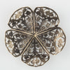 Oxidized brass filigree in a buttercup shape. 45x15mm Sold individually.