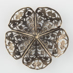 Oxidized brass filigree in a buttercup shape. 45x15mm Sold individually.