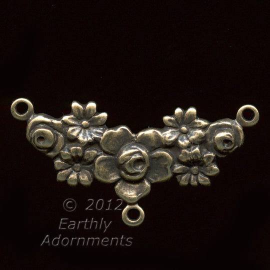 Oxidized stamped brass 3 ring connector in floral garland motif. 26mm x 10mm. Pkg. of 2. b9-0834
