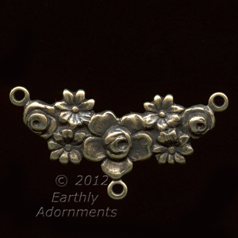 Oxidized stamped brass 3 ring connector in floral garland motif. 26mm x 10mm. Pkg. of 2. 