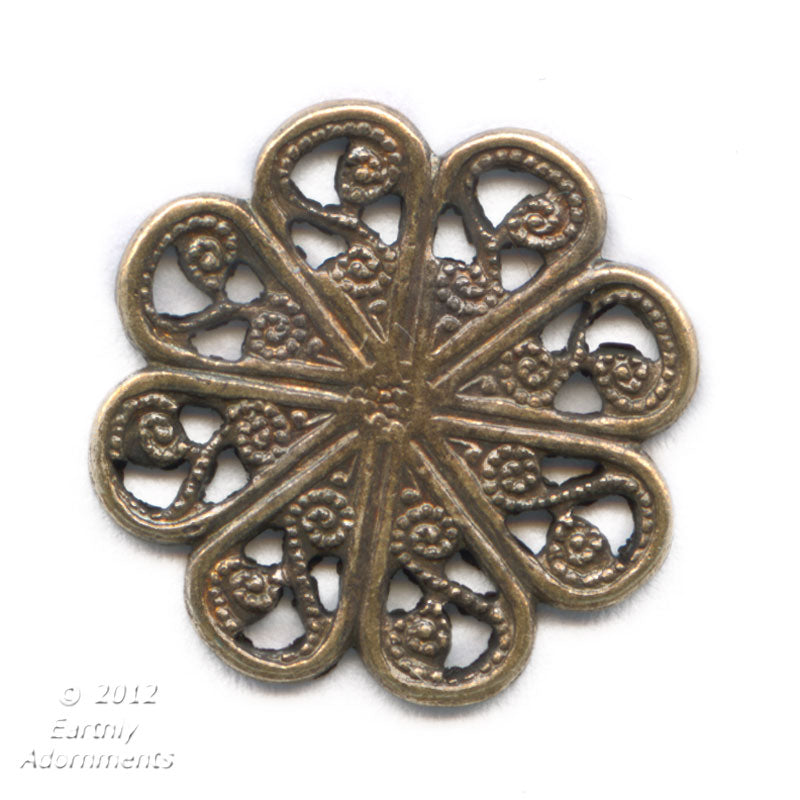 Vintage brass circular stamping.Decorative stamping on front. Smooth back. 15mm. Pkg. of 6