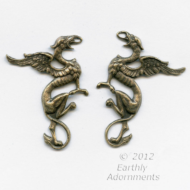 Oxidized brass stamped gryphons, one pair, 43x32mm.