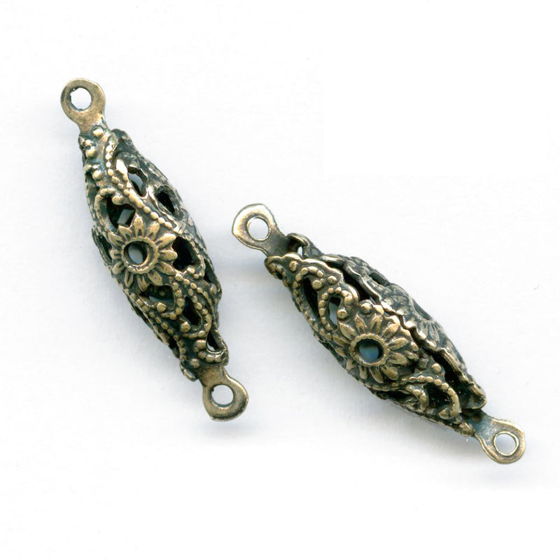 Oxidized brass stamped filigree oval 2 ring connector beads.  Pkg of 4.