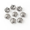 Stamped sterling silver plated brass bead cap in a floral design. 9x4mm. Package of 12. 