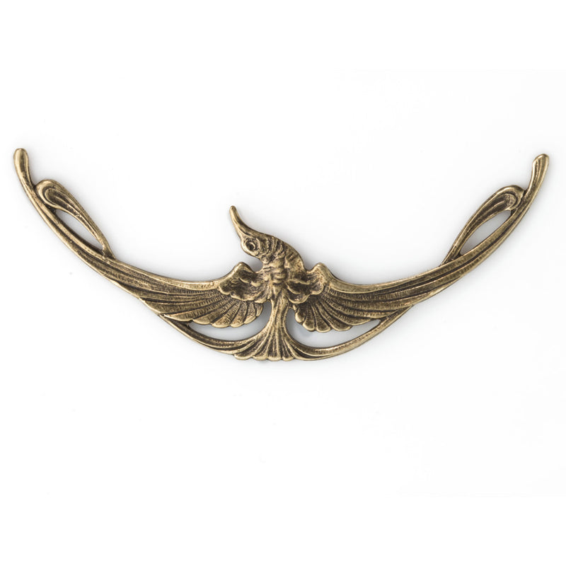 Oxidized brass Art Nouveau style stamping of a bird in flight. 70x20mm. Sold individually.