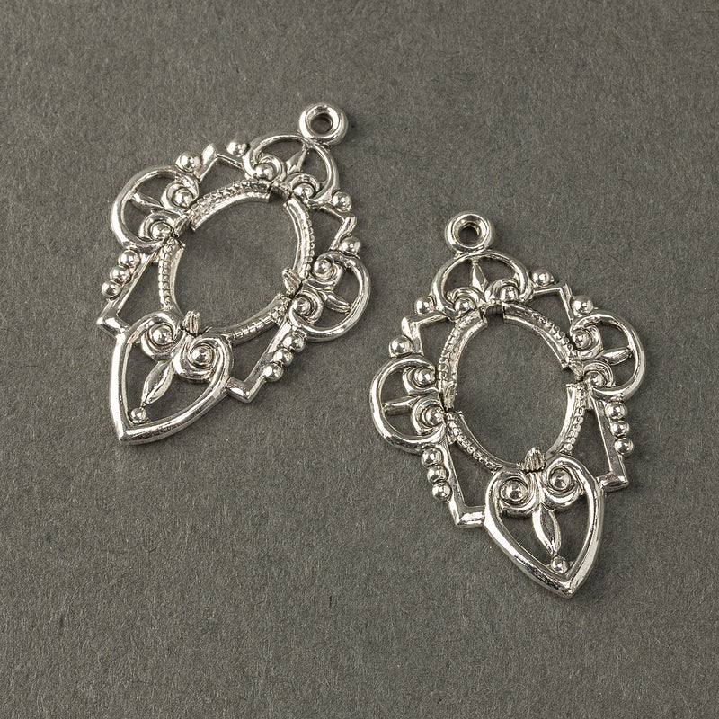 Stamped sterling silver plated brass pronged setting for 14x10mm cabochon. 37x25mm a. Pckage of 2. 