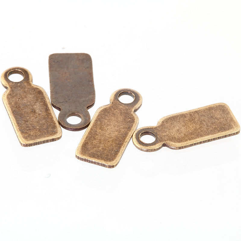 Oxidized brass rectangular tabs. Glue on to stones or cabochons.  12x5mm. Pkg 4.