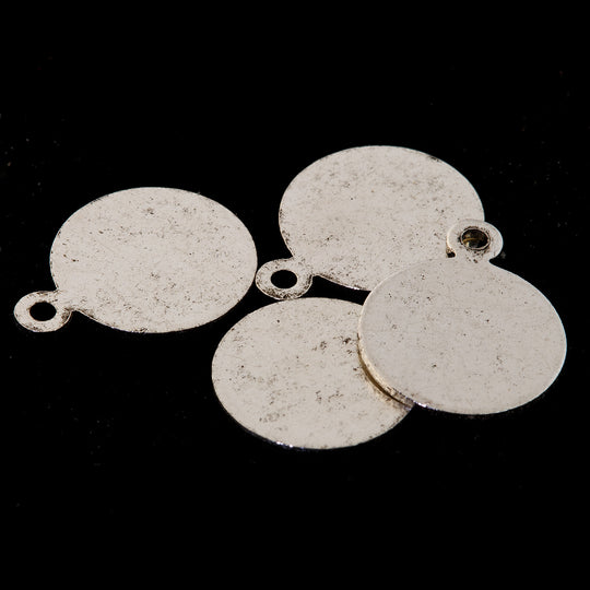 Silver plated brass round tabs with ring. Glue on to stones or cabochons.  8mm. diameter. Pkg 4. B9-2501s