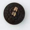 Antique Japanese Meiji period shakudo disk brooch.