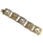 Vintage bracelet of silver vermeil goldwash filigree panels with llamas and rosettes