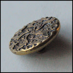 Antique stamped ornamental button 7/8 inch.