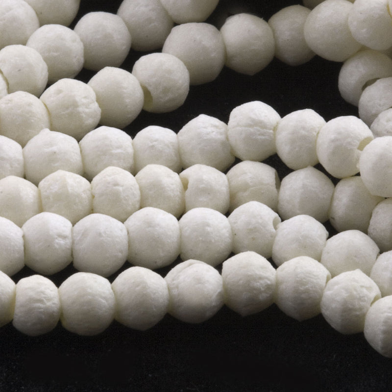 Vintage 3.5mm carved white bone rounds, strand of 100, India.