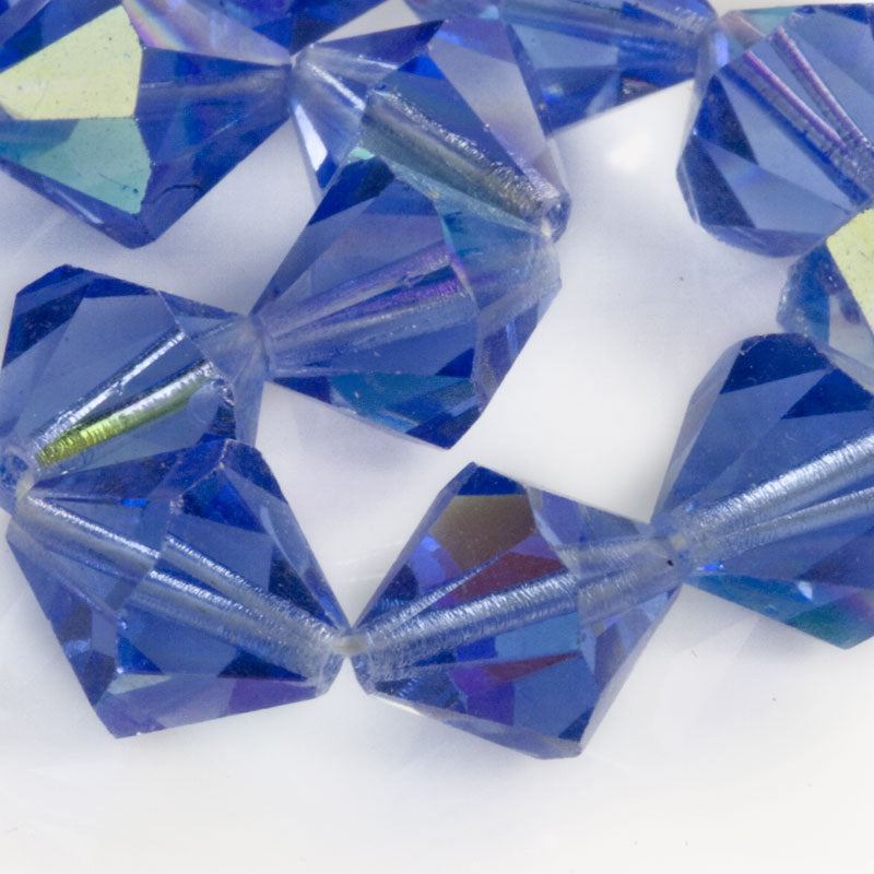 Vintage tin cut sapphire blue faceted bicones with partial AB finish, Czechoslovakia, 1950-60s. 12mm. Pkg of 6.