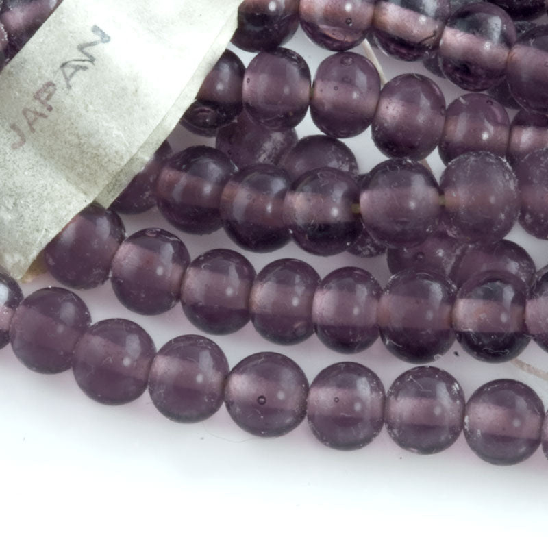 Vintage translucent amethyst glass rounds Japan 4mm strand of 55. 