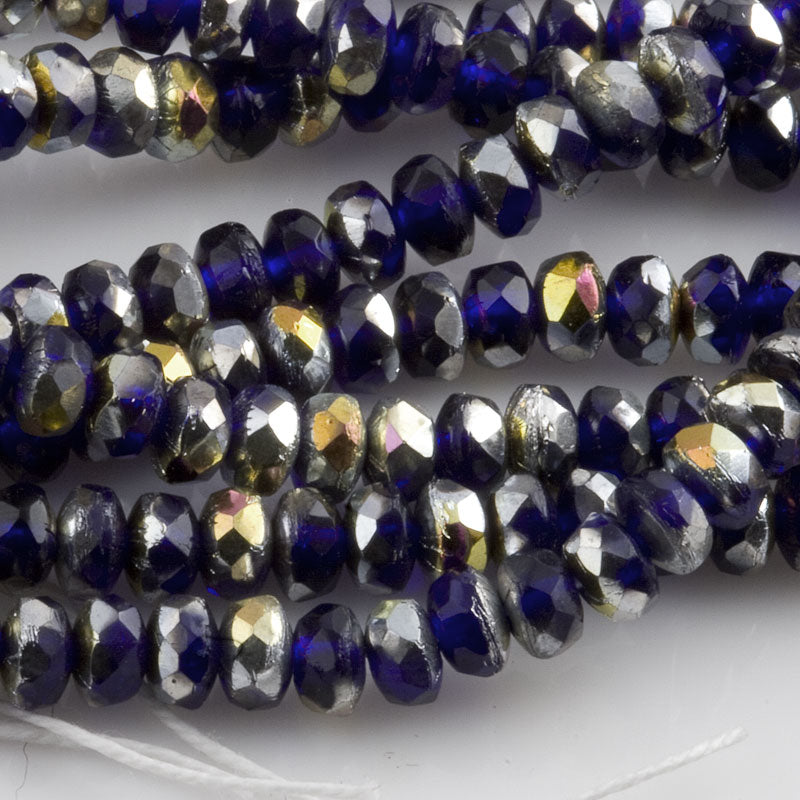 Mixed strand of faceted blue, silvered and AB rondelles 2x4mm. 5.5 inch strand of 50 beads.