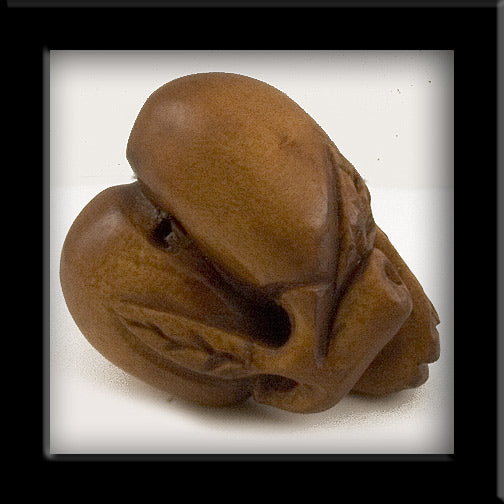 Hand carved boxwood cicada on peach ojime bead. 18x22mm. Pkg. of 1.