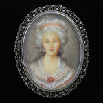 Antique Victorian sterling silver brooch with hand painted portrait on ivory.