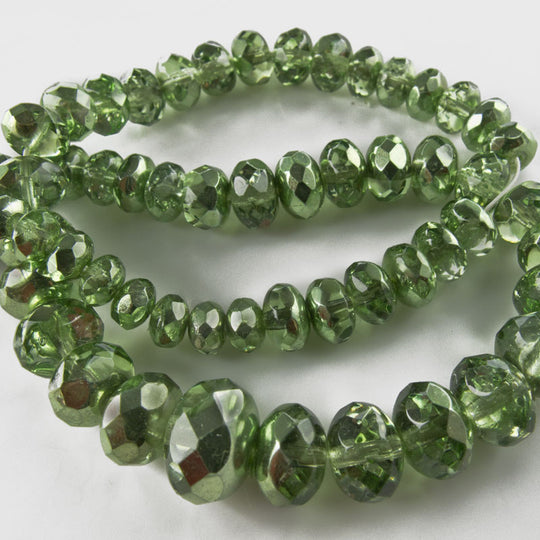 Olive green luster gemstone cut graduated 10mm x 5mm to 4mm x 2mm. 16.5 inch strand. b11-gr-0962(e)