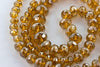 Graduated knotted strand gemstone-cut citrine luster glass bead strand.16 in. strand. 