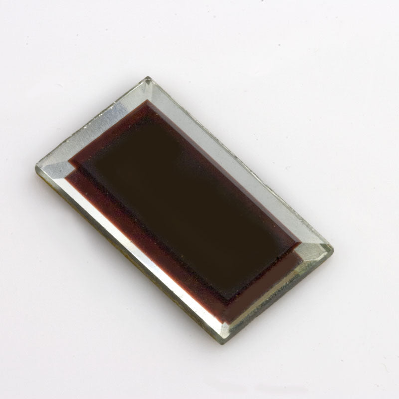Vintage beveled silver foil cab with dark red center. 28x15mm Sold individually. 