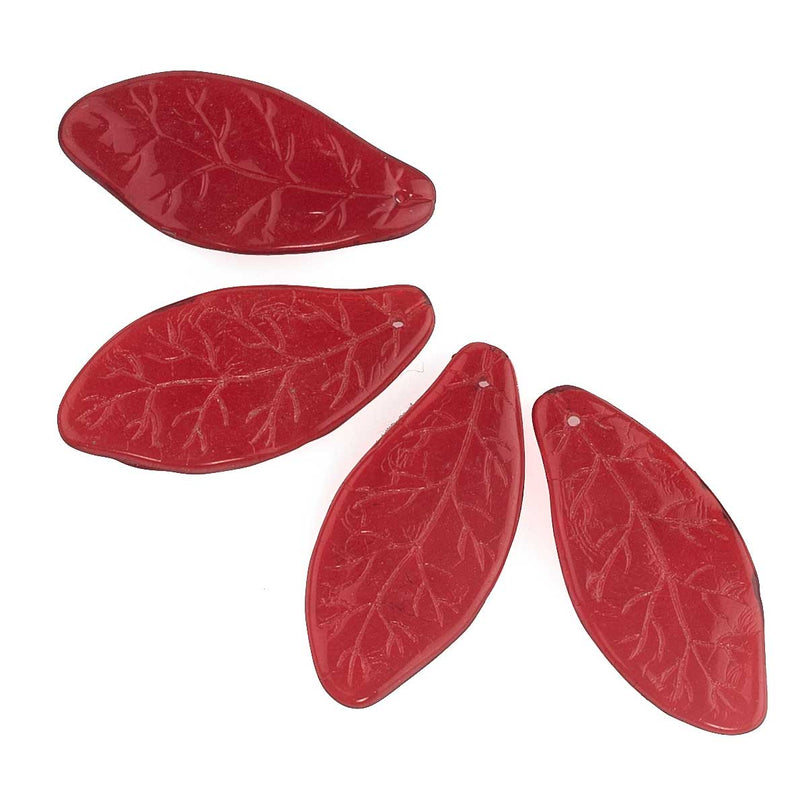 Vintage pressed glass leaf pendant in translucent dark red. 35x16mm. Czechoslovakia. Package of 4.