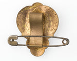 Antique enamel dress clip with attached safety pin.