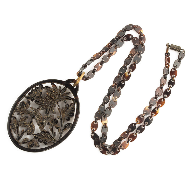 -Vintage carved openwork tortoise shell pendant on a tortoise shell link chain