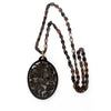 -Vintage carved openwork tortoise shell pendant on a tortoise shell link chain
