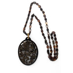 -Vintage carved openwork tortoise shell pendant on a tortoise shell link chain